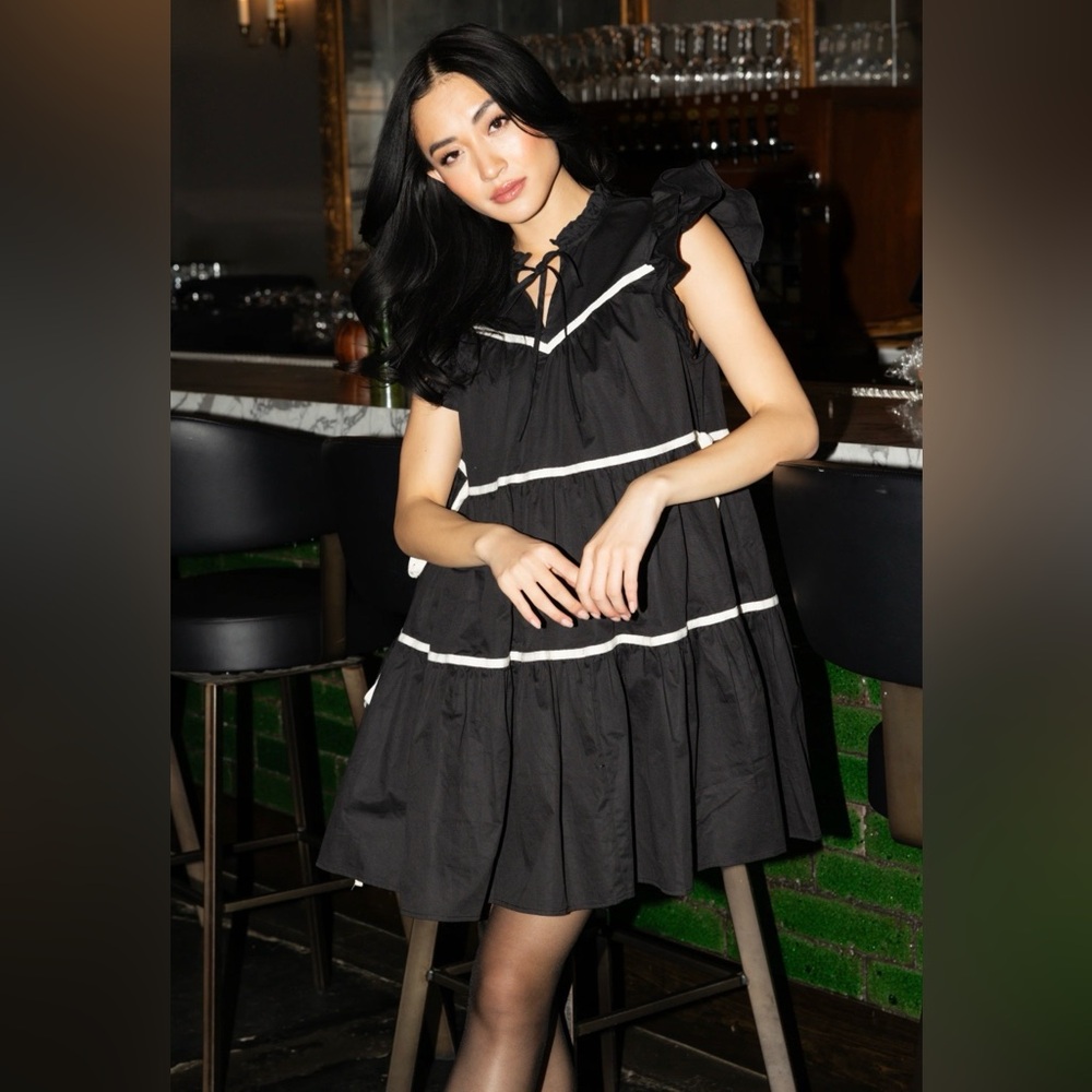 Chic Black Dress with White Trim